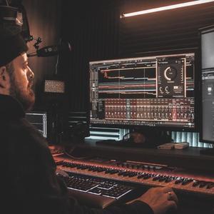 a person mixing music in a studio