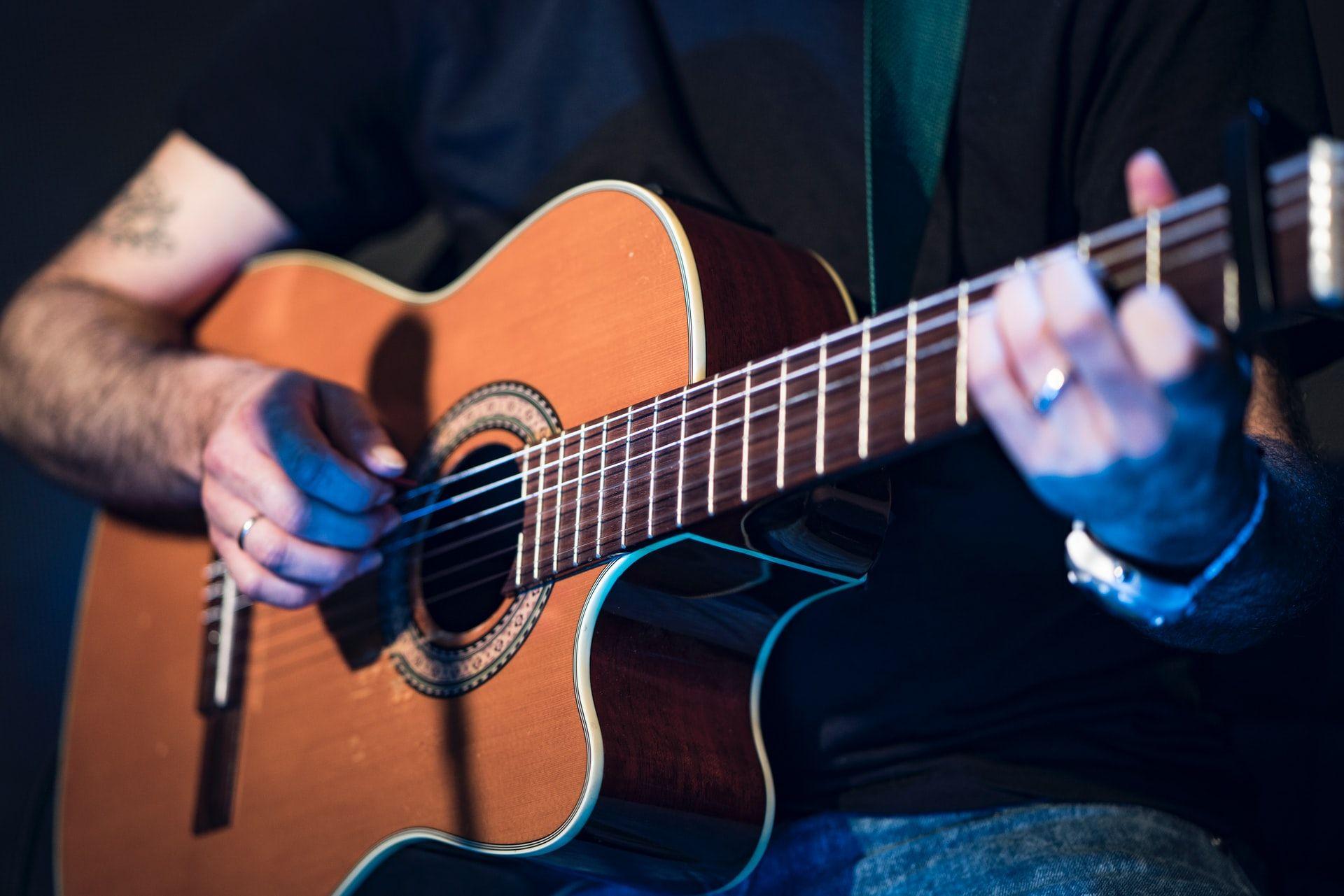 a person holding a guitar